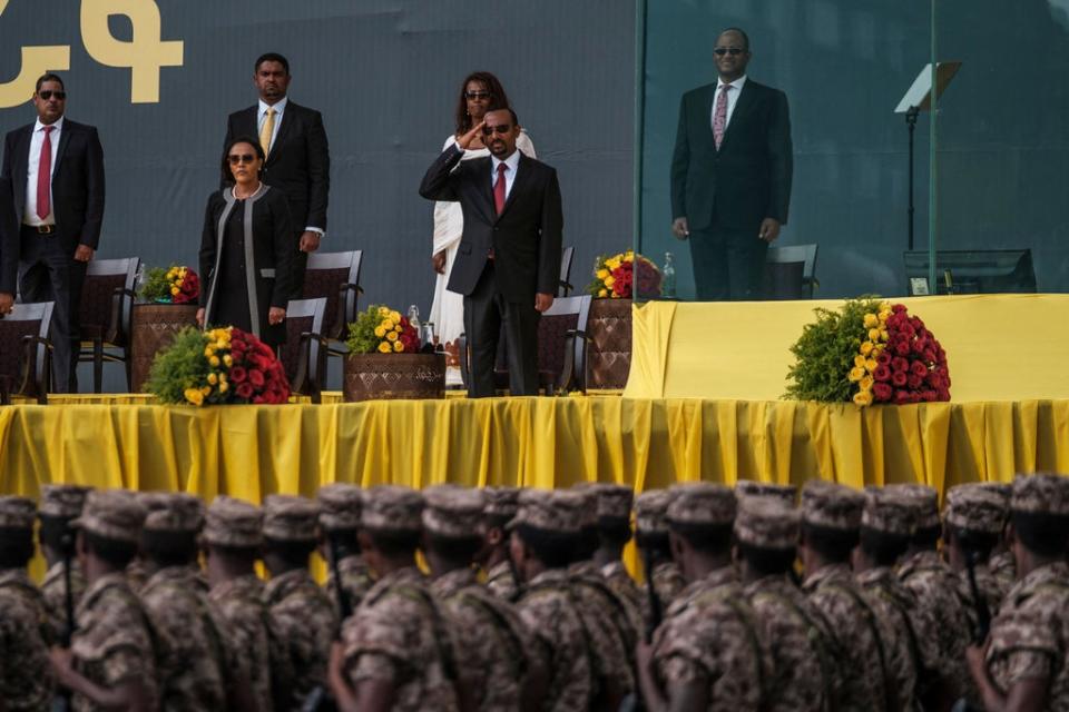 Ethiopian prime minister Abiy Ahmed (1st row, R) salutes members of the national defence forces (AFP via Getty Images)