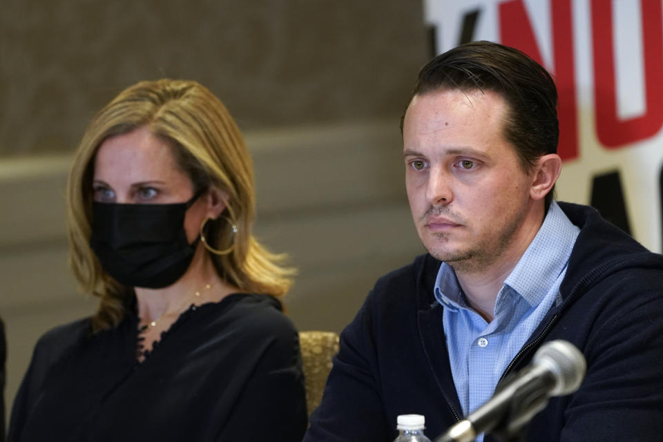 Chad Gregory and his wife Meghan, parents of Keegan Gregory, appear during a news conference in Southfield, Mich., Thursday, Jan. 27, 2022. A new lawsuit alleging negligence by school officials and a Michigan school shooting suspect's parents was filed over the attack at Oxford High School that killed four students and wounded six other students and a teacher. (AP Photo/Paul Sancya)