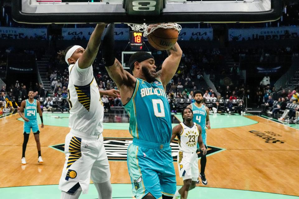 Feb 4, 2024; Charlotte, North Carolina, USA; Charlotte Hornets forward Miles Bridges (0) dunks against the Indiana Pacers during the second half at Spectrum Center. Mandatory Credit: Jim Dedmon-USA TODAY Sports