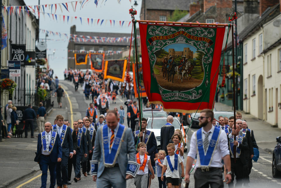 <p>Members of the Orange Order and their supporters take part in the Twelfth of July parade in Hillsborough village as part of the celebrations which marks the victory of King William of Orange over the catholic King James at the Battle of the Boyne in 1690.  On Sunday, 12 July 2021, in Hillsborough, County Down,  Northern Ireland (Photo by Artur Widak/NurPhoto via Getty Images)</p>
