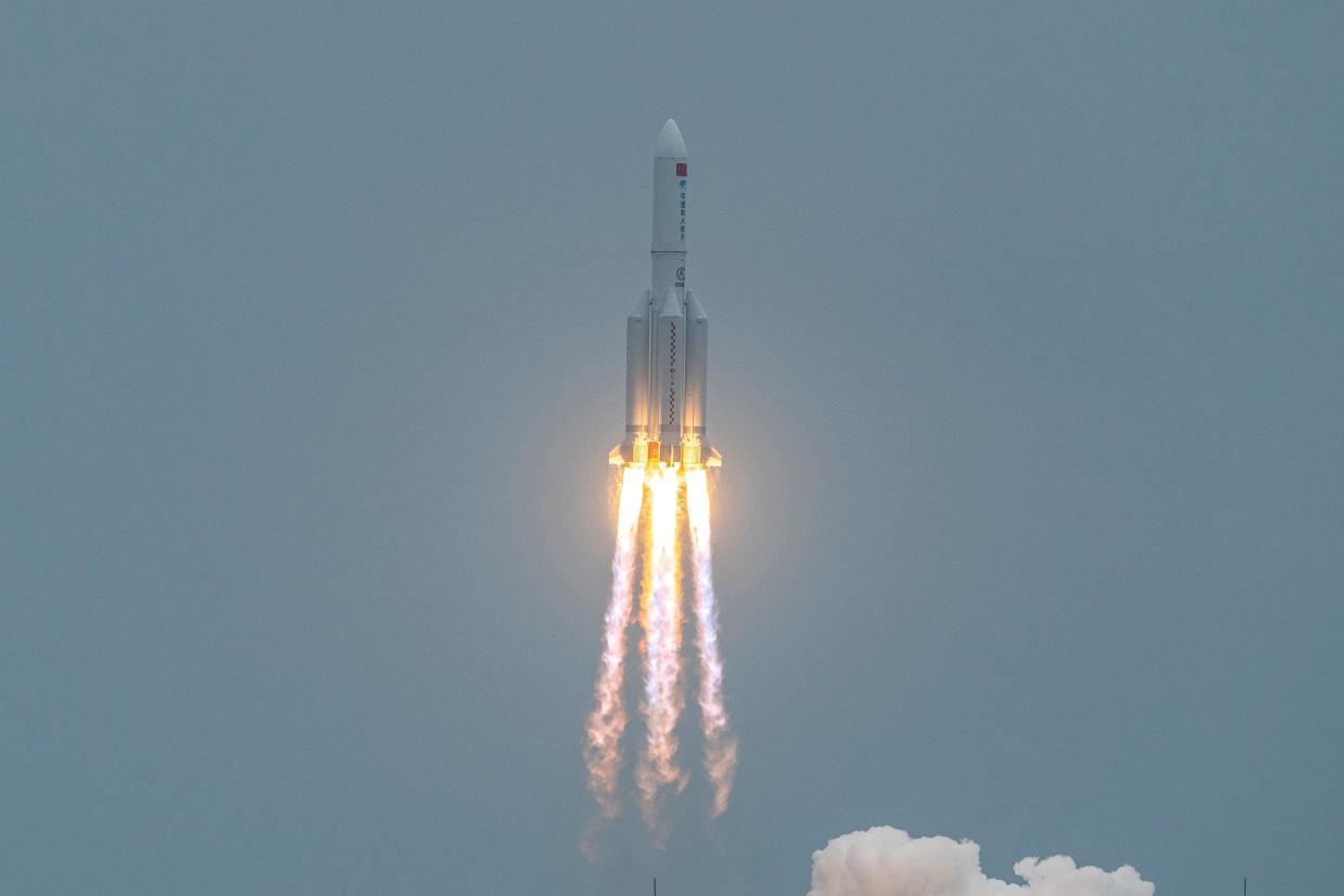 <p>A Long March 5B rocket, carrying China's Tianhe space station core module, lifts off from the Wenchang Space Launch Center in southern China's Hainan province on April 29, 2021</p> (Photo by STR/AFP via Getty Images)