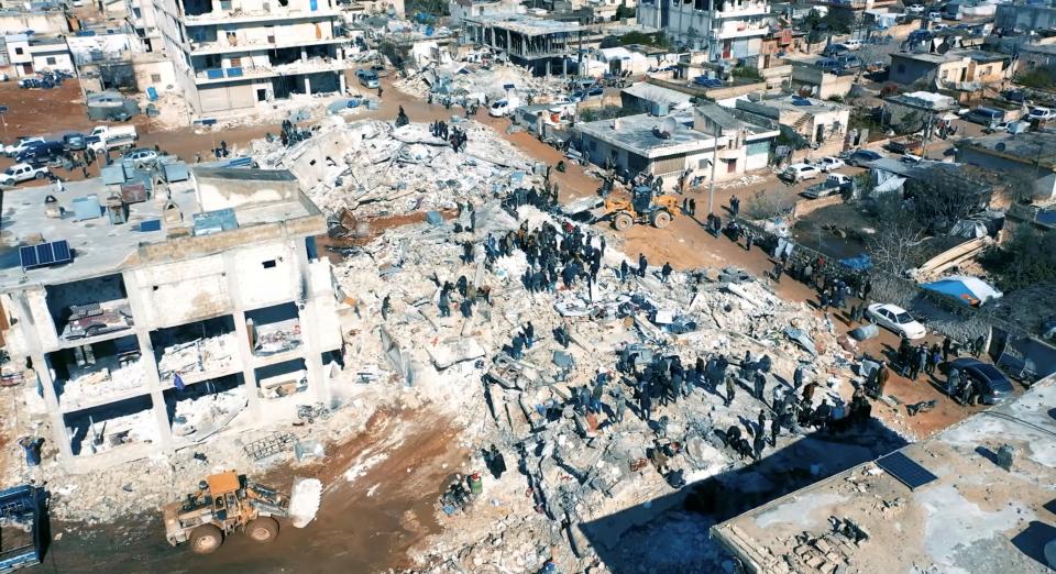 Damaged buildings and rescue operations are seen in the aftermath of the earthquake, in Aleppo (White Helmets/Handout via REUTERS)