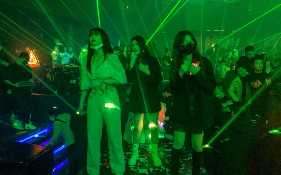 People visit a nightclub in Wuhan on January 21