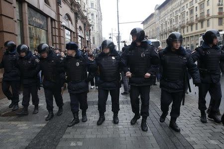 Policemen stand guard during an unsanctioned anti-government protest in central Moscow, Russia, April 2, 2017. REUTERS/Maxim Shemetov