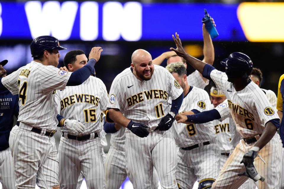 Rowdy Tellez celebrates a walk-off single in the 10th inning against the San Francisco Giants on Aug. 6, 2021. Tellez, who struggled on offense last season, has signed a one-year deal with the Pittsburgh Pirates.