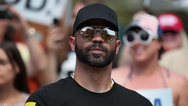 PHOTO: Enrique Tarrio, leader of the Proud Boys, stands outside of the Hyatt Regency where the Conservative Political Action Conference is being held, Feb. 27, 2021, in Orlando, Fla. (Joe Raedle/Getty Images)