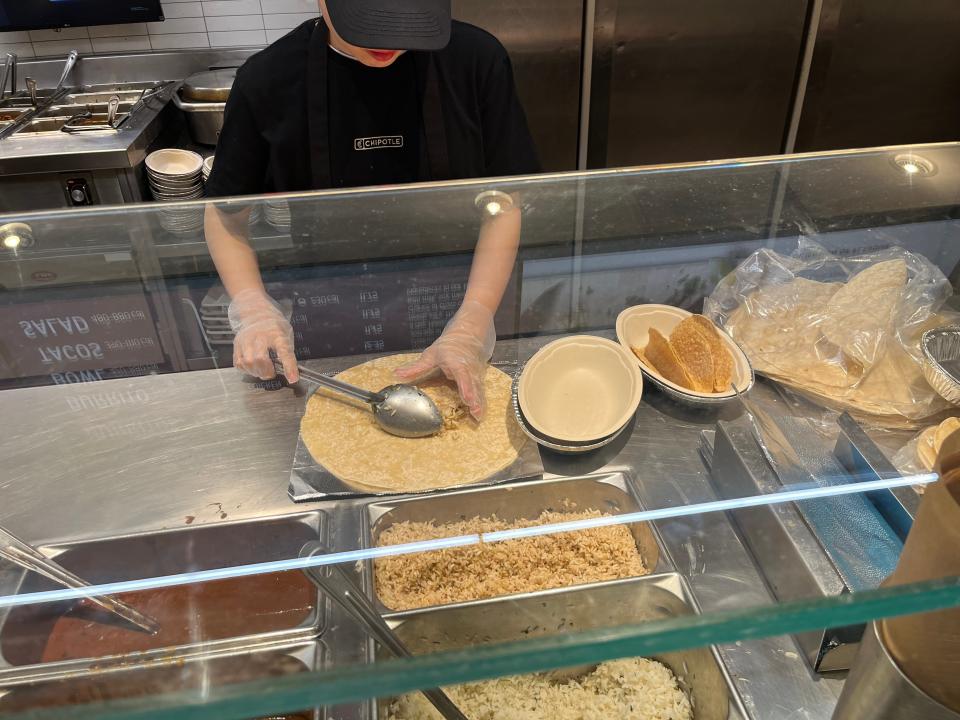 chipotle worker filling tiffany's order at a location in toronto