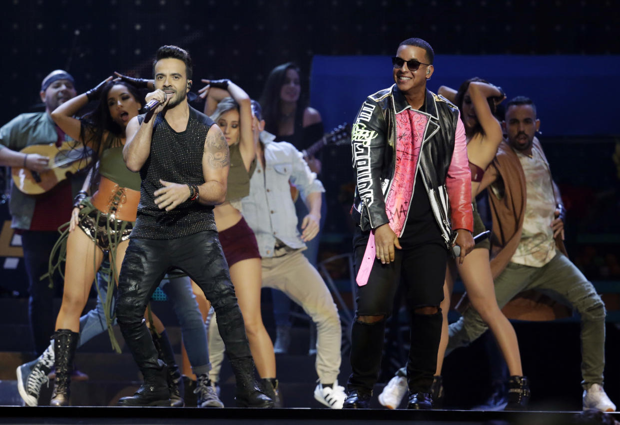 FILE – In this April 27, 2017 file photo, singers Luis Fonsi, left and Daddy Yankee perform during the Latin Billboard Awards in Coral Gables, Fla. The ubiquitous hit song “Despacito” has tied Mariah Carey’s 16-week record at No. 1 on the Billboard Hot 100 chart. Billboard announced Monday, Aug. 28, that Luis Fonsi’s song and Carey’s duet with Boyz II Men, “One Sweet Day,” are the longest-running No. 1 songs in the 59-year history of the charts. (AP Photo/Lynne Sladky, File)