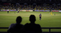 Fans in the stands watch the Texas Super Kings and Los Angeles Knight Riders compete in a Major League Cricket match in Grand Prairie, Texas, Thursday, July 13, 2023. On a pitch north of Dallas, in the searing evening heat of the Texas summer, a game of professional cricket was unfolding in front of a bemused crowd of fans. (AP Photo/LM Otero)