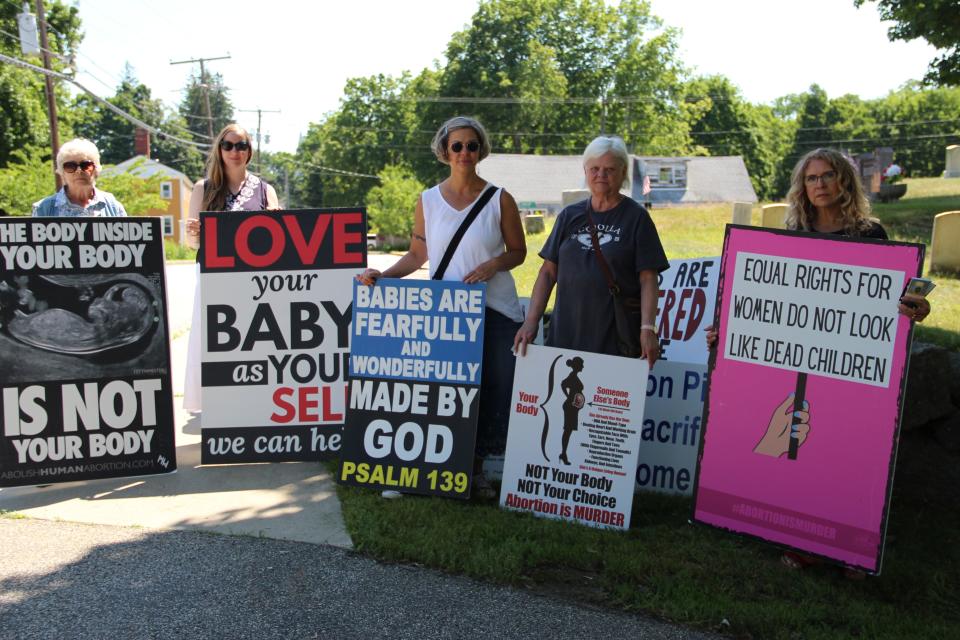 Anti-abortion protesters outside the Lovering Health Center in Greenland Friday, July 15, 2022.