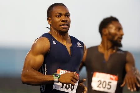 Athletics - JAAA National Senior Championships - Men's 200m final - National Stadium Kingston, Jamaica - June 25, 2017 Jamaica's Yohan Blake (L) and Rasheed Dwyer in action. REUTERS/Lucy Nicholson