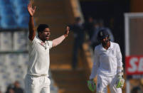 Cricket - India v England - Third Test cricket match - Punjab Cricket Association Stadium, Mohali, India - 26/11/16. India's Umesh Yadav (L) celebrates after dismissing England's Haseeb Hameed. REUTERS/Adnan Abidi