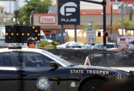 <p>A Florida State Trooper blocks the road leading to the site of the shooting at the Pulse gay night club in Orlando, Florida, June 13, 2016. (REUTERS/Jim Young) </p>