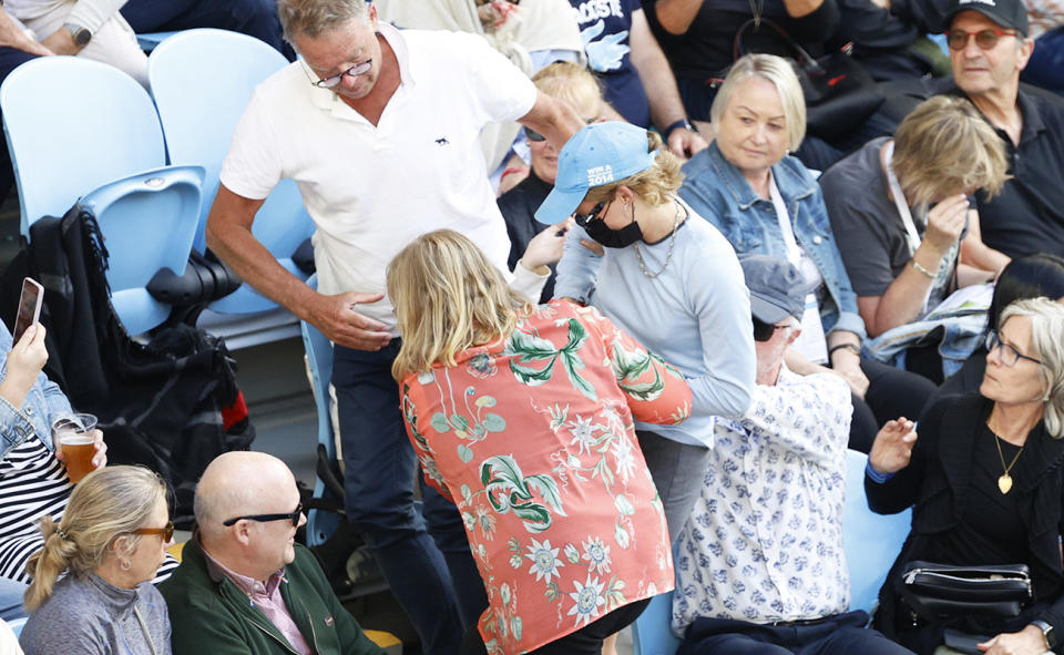 Spectators, pictured here removing the protester themselves.