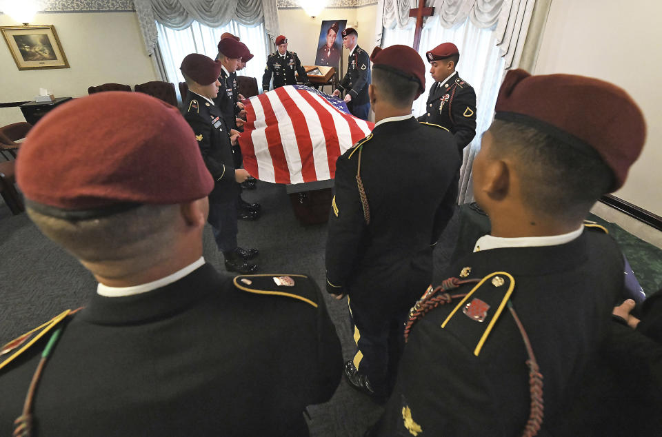 Members of the U.S. Army 18th Airborne Corps 82nd Airborne Division from Fort Bragg, North Carolina, place the U.S. flag on the casket containing the remains of U.S. Army Pfc. paratrooper Willard "Bud" Jenkins of Scranton, Pa., who was killed in action in 1944 during World War II on Wednesday, Sept. 27, 2018, at Edward J. Chomko Funeral Home in Scranton, Pa. ( Butch Comegys / The Scranton Times-Tribune via AP)