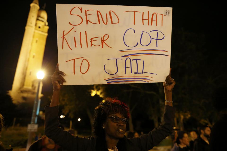 Protesters demonstrate after blocking an intersection after a vigil in St. Louis, Missouri, October 9, 2014. A 32-year-old white St. Louis police officer fatally shot 18-year-old Vonderrit Myers Jr. after the officer, who was off duty working for a private security company, saw Myers and two friends running and pursued them, according to a statement issued by the St. Louis police department. (REUTERS/Jim Young)