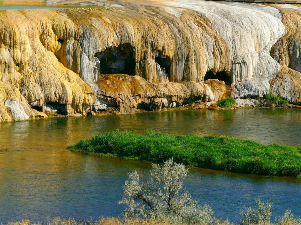 <p>Located in the Big Horn Basin of northwest Wyoming, Thermopolis claims to have the world's largest mineral hot springs. In addition to the hot water that cascades down in Hot Springs State Park, the city is home to the <a href="https://wyomingdinosaurcenter.org/" rel="nofollow noopener" target="_blank" data-ylk="slk:Wyoming Dinosaur Center;elm:context_link;itc:0;sec:content-canvas" class="link ">Wyoming Dinosaur Center</a>, which houses thousands of fossils discovered in the area and around the world.</p>