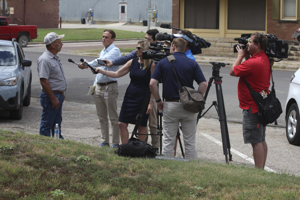 Darwin Mackey, a Marion, Kansas, resident, speaks with reporters about the raid on the Marion County Record, the town's weekly newspaper, Monday, Aug. 14, 2023, outside the Marion County Courthouse and across the street from the newspaper's office, in Marion, Kan. (AP Photo/John Hanna)