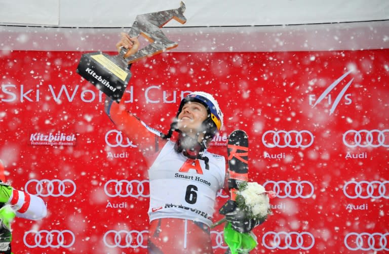 Henrik Kristoffersen poses on the podium after winning the men's slalom event at the FIS Alpine World Cup on January 21, 2018