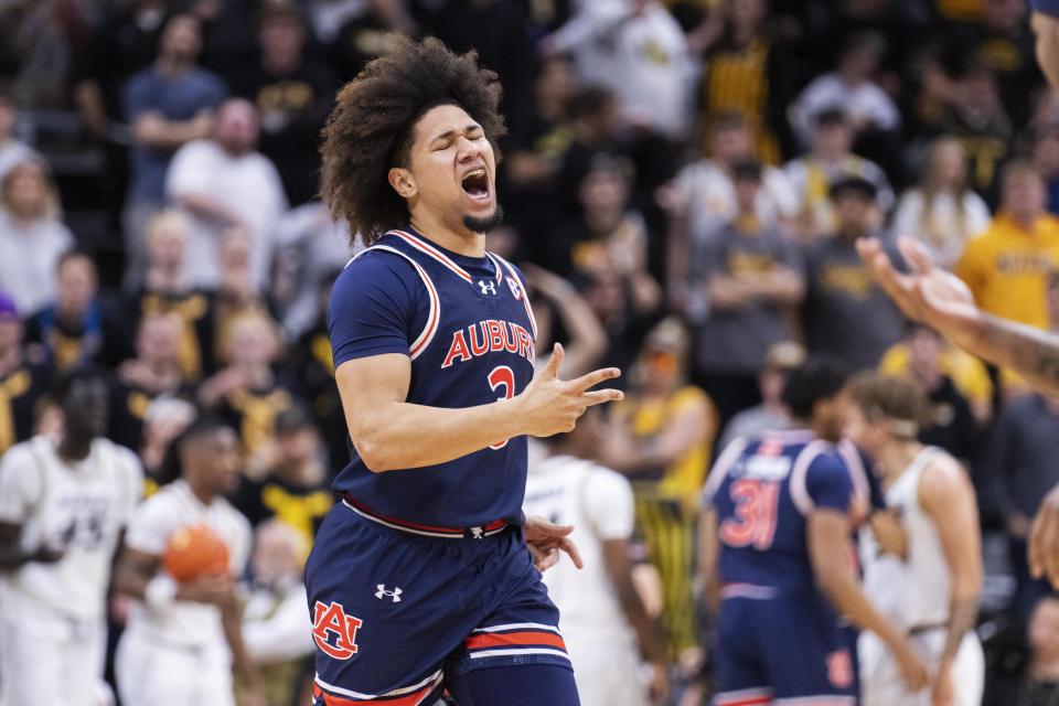 Auburn's Tre Donaldson celebrates a 3-point basket against Missouri during the second half of an NCAA college basketball game Tuesday, March 5, 2024, in Columbia, Mo. (AP Photo/L.G. Patterson)