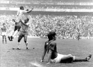 FILE - In this June 21, 1970 file photo, Brazil's Pele jumps for joy after scoring his team's first goal against Italy in the first half of a World Cup final at Azteca Stadium in Mexico City, before winning 4 - 1. On Oct. 23, 2020, the three-time World Cup winner Pelé turns 80 without a proper celebration amid the COVID-19 pandemic as he quarantines in his mansion in the beachfront city of Guarujá, where he has lived since the start of the pandemic. (AP Photo/Kurt Strumpf, File)