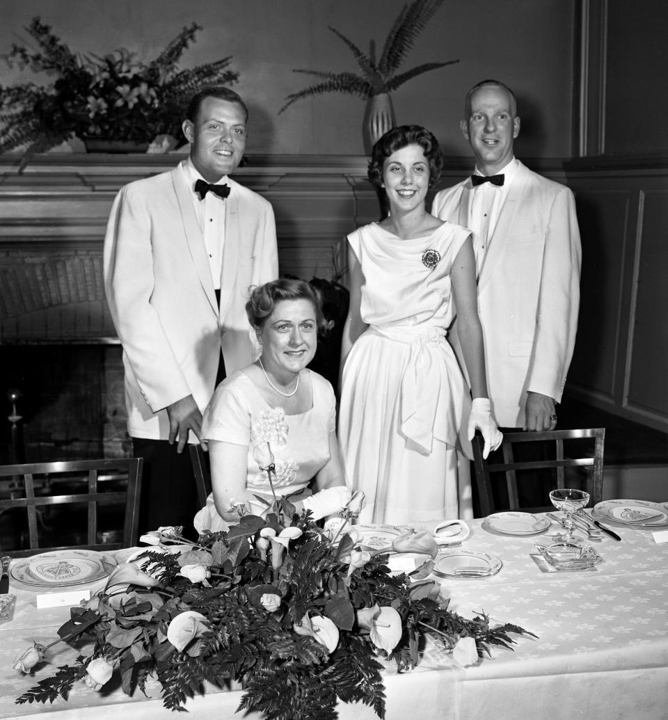Gilbert Merritt Jr., left, and his mother, Mrs. Gilbert Merritt, pose with Mrs. Merritt's niece, Miss Rachel Donelson Merritt and her fiancé, Joseph Phelps McAllister, as they host a rehearsal dinner for the couple at Belle Meade Country Club June 30, 1961.