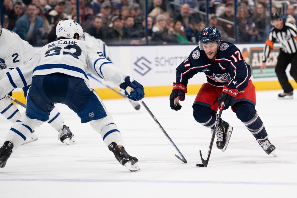 Dec 29, 2023; Columbus, Ohio, USA;
Columbus Blue Jackets right wing Justin Danforth (17) makes his way down the rink against Toronto Maple Leafs defenseman Jake McCabe (22) during the third period of their game on Friday, Dec. 29, 2023 at Nationwide Arena.