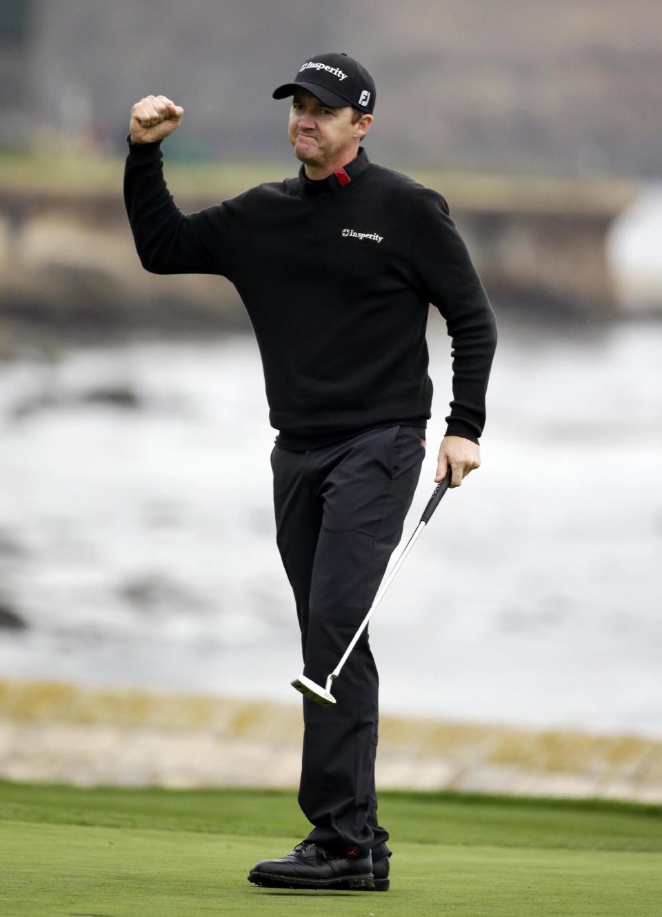 Jimmy Walker celebrates on the 18th green Sunday, Feb. 9, 2014, after winning the AT&T Pebble Beach Pro-Am golf tournament in Pebble Beach, Calif. (AP Photo/Eric Risberg)