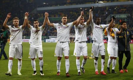 Borussia Dortmund L-R Ciro Immobile, Henrikh Mkhitaryan, Sven Bender, Vasquez Ramos, Ilkay Guendogan and Shinji Kagawa celebrate their victory against Dynamo Dresden following their German Cup (DFB Pokal) soccer match in Dresden March 3, 2015. REUTERS/Hannibal Hanschke