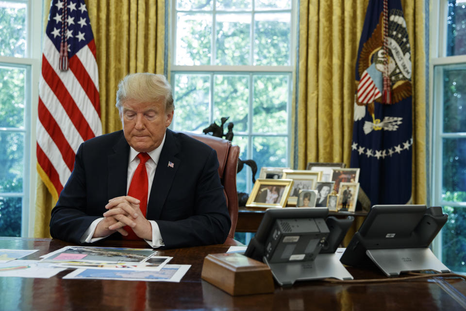 President Donald Trump listens during a briefing on Hurricane Dorian in the Oval Office of the White House, Wednesday, Sept. 4, 2019, in Washington. (AP Photo/Evan Vucci)