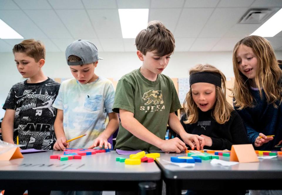 Pioneer Elementary School second- and third-grade students judge shapes that they created using pattern blocks during their math class in Gig Harbor, Wash. on May 1, 2023.