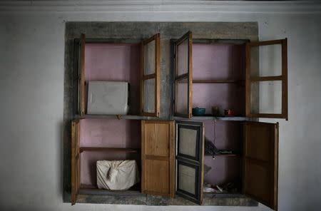 Empty cupboards are seen inside an abandoned house in western Mosul, Iraq, April 12, 2017. REUTERS/Andres Martinez Casares/Files