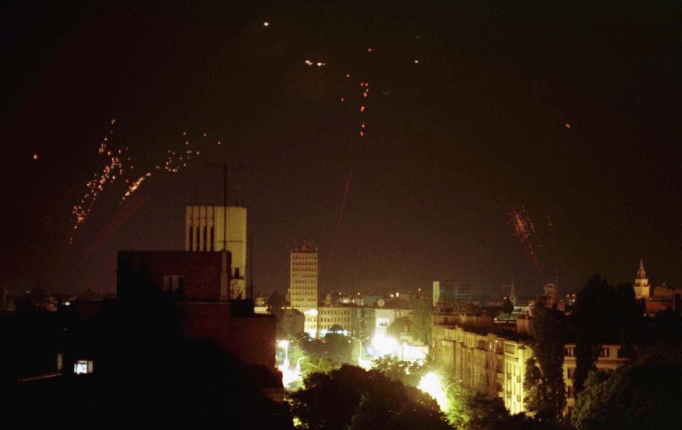 FILE - Anti-aircraft artillery is fired into the skies over Novi Sad, some 80 km (50 miles) northwest of Belgrade, in the early morning hours of May 3, 1999. Well before Russian tanks and troops rolled into Ukraine, Vladimir Putin was using the bloody breakup of Yugoslavia in the 1990s to ostensibly offer justification for the invasion of a sovereign European country. The Russian president has been particularly focused on NATO’s bombardment of Serbia in 1999 and the West’s acceptance of Kosovo’s declaration of independence in 2008. He claims both created an illegal precedent that shattered international law and order, apparently giving him an excuse to invade Ukraine. (AP Photo, File)