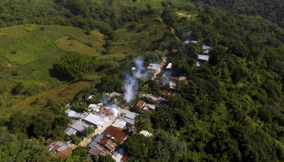 In this photo taken on Aug. 29, 2019, plumes of smoke caused by the pesticide that annihilates dengue-transmitting mosquitoes, in Los Sitios, El Salvador. As a region, Central America and Mexico have already recorded nearly double the number of dengue cases as in all the previous year. (AP Photo/Salvador Melendez)