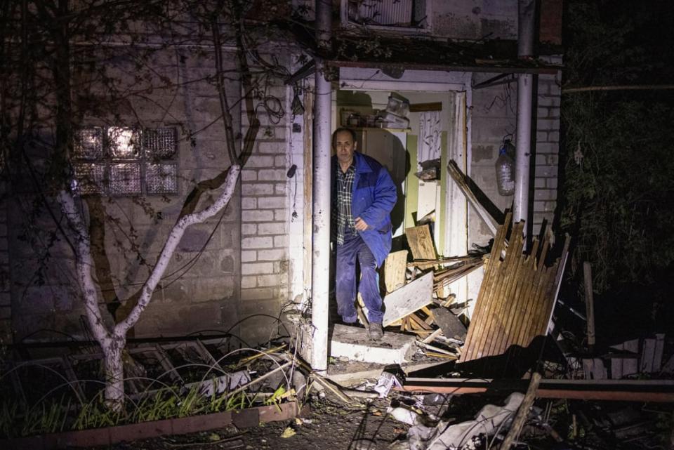 <div class="inline-image__caption"><p>A local resident in a village outside of Kharkiv stands next to his house, which was badly damaged by a Russian missile strike.</p></div> <div class="inline-image__credit">Reuters/Yevhen Titov</div>