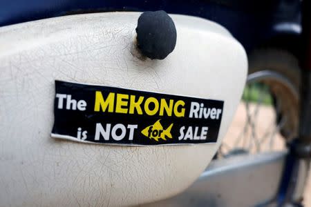 A sticker is seen at the Thailand side of the Mekong River, at the border between Laos and Thailand April 23, 2017. Picture taken April 23, 2017. REUTERS/Jorge Silva