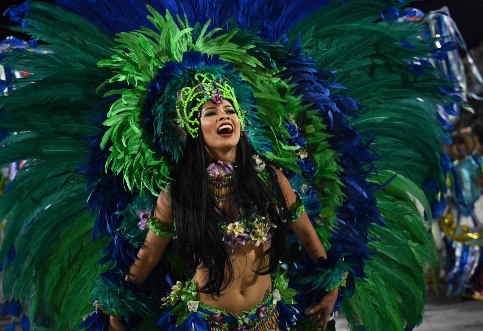 A member of the Beija Flor samba school performs during the second night of Rio's Carnival parade at the Sambadrome Marques de Sapucai in Rio de Janeiro, Brazil on Feb. 21, 2023. - The world's biggest carnival hit peak party level as Rio's top samba schools on Feb. 19 opened their annual parade competition in the giant avenue-turned-stadium known as the "Sambadrome."