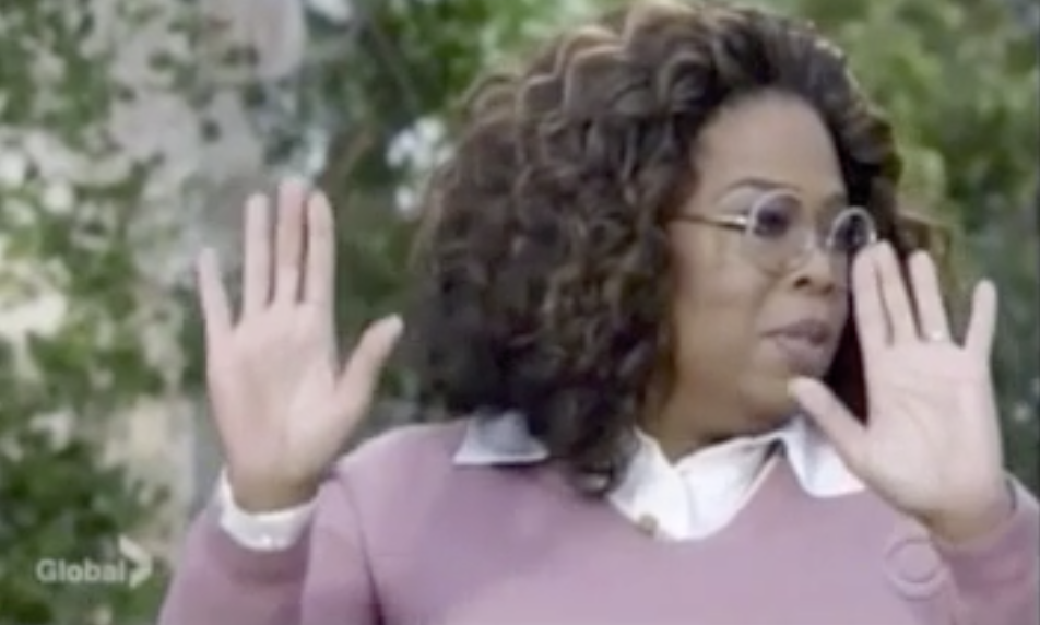 oprah with hands up