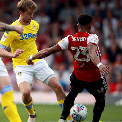 Brentford's Julian Jeanvier challenges Leeds United's Patrick Bamford - Credit: PA