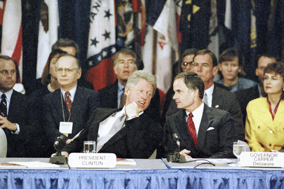 FILE - President Bill Clinton and Delaware Gov. Tom Carper talk before Clinton made his speech to the National Governors' Association Conference held in Tulsa, Oklahoma, Aug. 16, 1993. Democratic Sen. Tom Carper of Delaware announced Monday, May 22, 2023, that he will not seek reelection to a fifth term in the U.S. Senate. (AP Photo/David Longstreath, File)