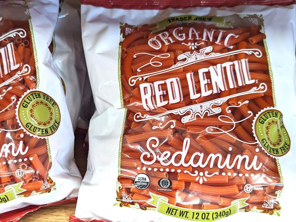 Bags of Trader Joe's gluten-free organic red-lentil sedanini.