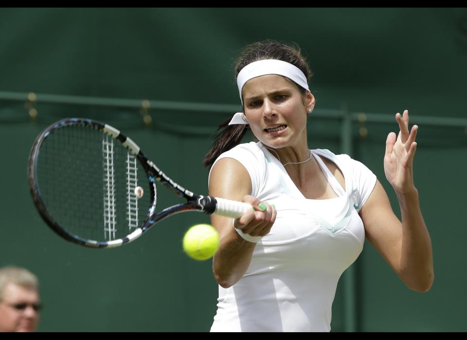 Julia Goerges of Germany returns a shot against Anastasiya Yakimova of Belarus during a second round women's singles match at the All England Lawn Tennis Championships at Wimbledon, England, Thursday, June 28, 2012.