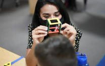 Teacher Juliana Urtubey works with a student in a class at Kermit R Booker Sr Elementary School Wednesday, May 5, 2021, in Las Vegas. Urtubey is the the 2021 National Teacher of the Year. (AP Photo/John Locher)