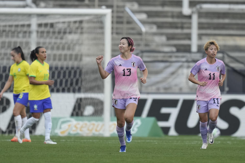 Japan's Jun Endo, center, celebrates after scoring her side's second goal from the penalty spot during a women's friendly soccer match against Brazil at the Neo Quimica Arena in Sao Paulo, Brazil, Thursday, Nov. 30, 2023. (AP Photo/Andre Penner)