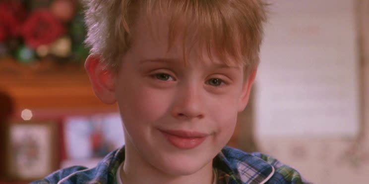 Macaulay Culkin smiling in Home Alone. Maybe because he knows Elvis is in it [Image via 20th Century Fox]