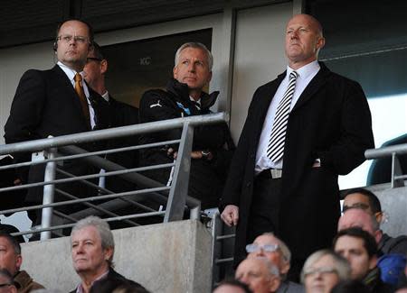 Newcastle United's manager Alan Pardew (top centre) watches from the stand after being sent off during their English Premier League soccer match against Hull City at the KC Stadium in Hull, northern England March 1, 2014. REUTERS/Nigel Roddis