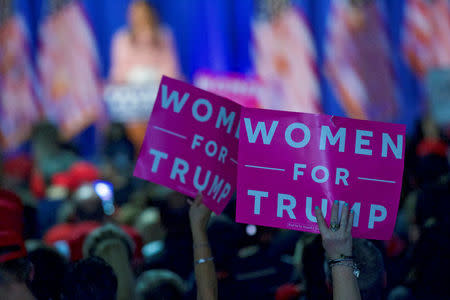 FILE PHOTO: Supporters wave "Women For Trump" posters while Melania Trump, wife to the Republican Presidential nominee Donald Trump, holds an event at Main Line Sports Centre in Berwyn, Pennsylvania, U.S. November 3, 2016. REUTERS/Mark Makela/File Photo