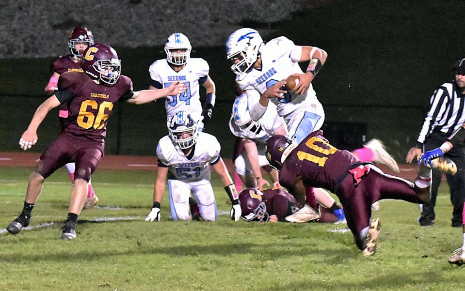 Seekonk's Jaden Arruda (3) tries to evade Case's Devin Silva (10).