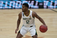 Baylor guard Jared Butler drives up court during the first half of a men's Final Four NCAA college basketball tournament semifinal game against Houston, Saturday, April 3, 2021, at Lucas Oil Stadium in Indianapolis. (AP Photo/Michael Conroy)