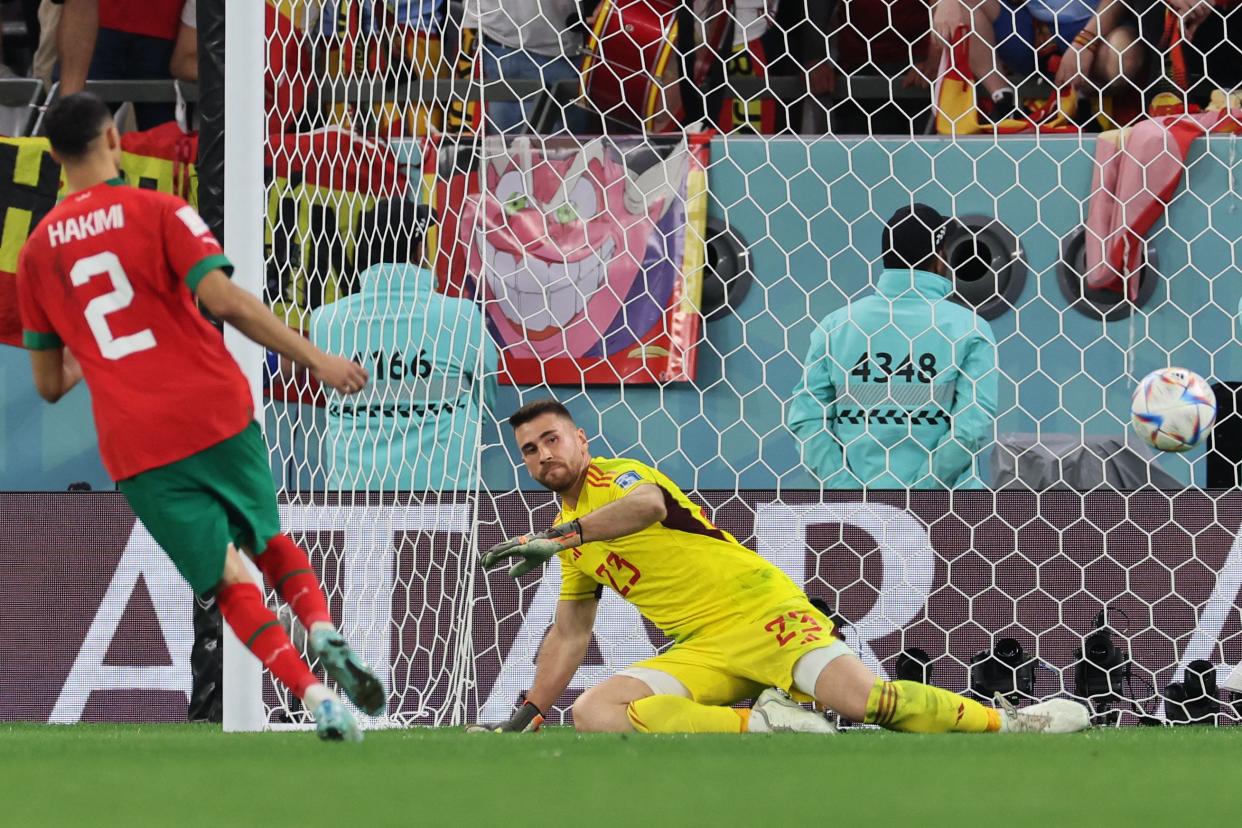 TOPSHOT - Morocco's defender #02 Achraf Hakimi (L) converts during the penalty shoot-out to win the Qatar 2022 World Cup round of 16 football match between Morocco and Spain at the Education City Stadium in Al-Rayyan, west of Doha on December 6, 2022. (Photo by KARIM JAAFAR / AFP) (Photo by KARIM JAAFAR/AFP via Getty Images)